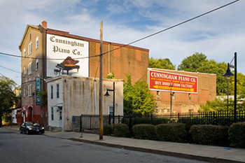Signage advertising Cunningham Piano Co. 