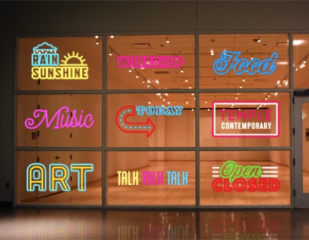 neon signs in front of gallery