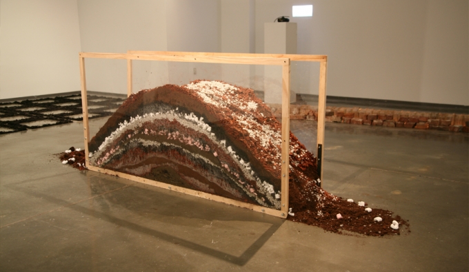 hump of material incased in glass frame