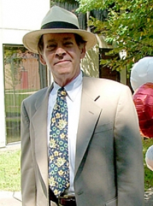 Dr. Cohen profile picture Dr. Cohen profile photo wearing a suit and floral hat