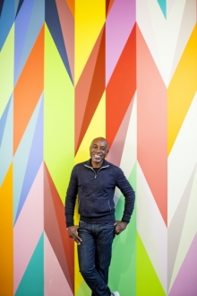 Odili Odita Odili Odita in front of painting