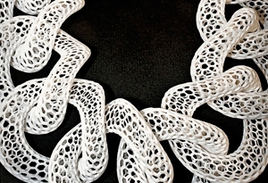 M/J/CC Faculty Work detail of white mesh-link links