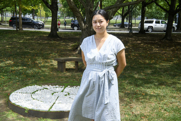 Rachel Hsu poses with her installation, The Weight of Our Living