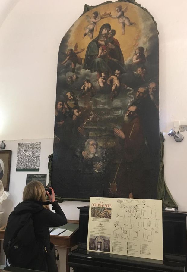 Elizabeth Duntemann photographing an altarpiece at the Ospedale Santa Maria del Popolo degli Incurabili in Naples, Italy