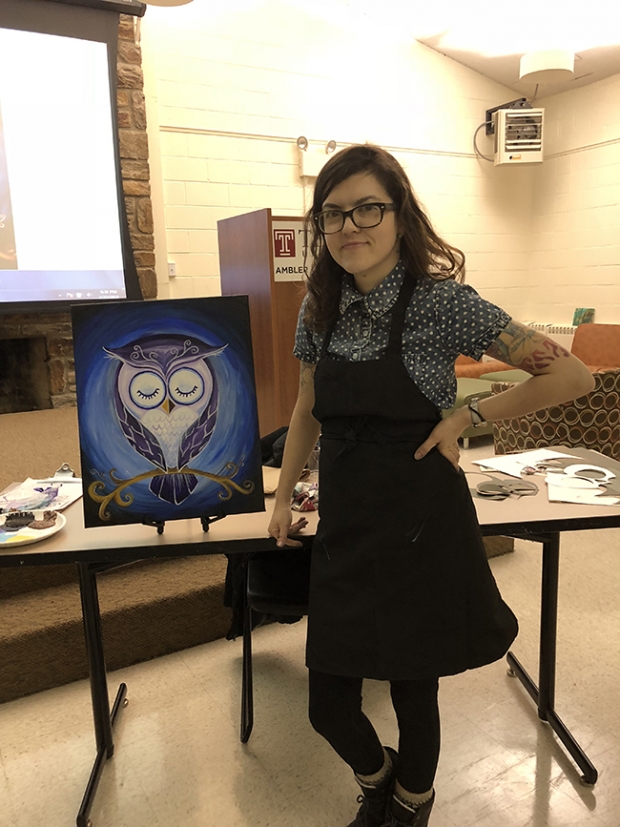 Joy paints an owl! Joy Waldinger aside her sample painting at the Ambler campus