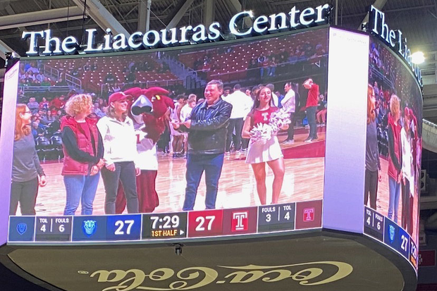 Mariola Alvarez, Erin Pauwels, Hooter the Owl, coach and Temple cheerleader