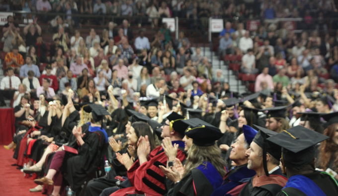 Crowd applauding at graduation