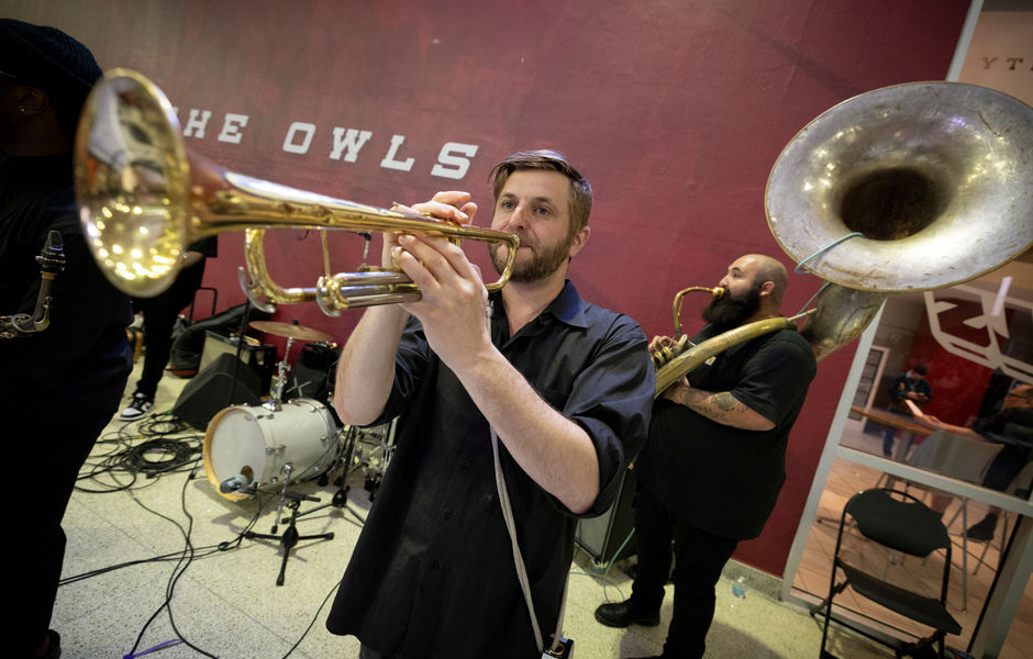 Members of brass band "Snacktime" playing the trumpet and tuba