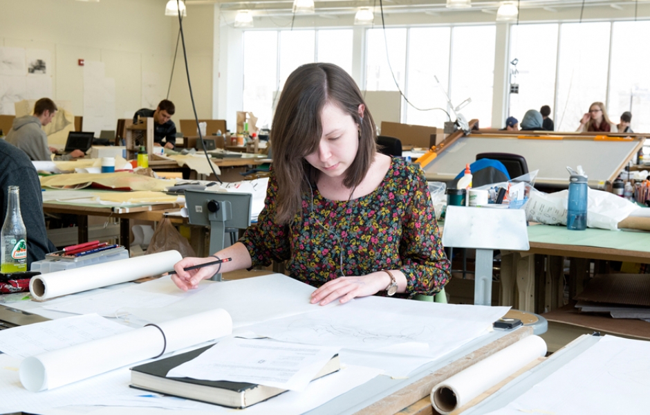 female student working on drawings