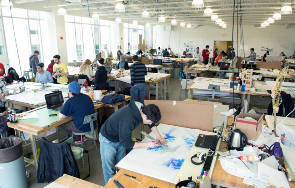 large studio filled with students working