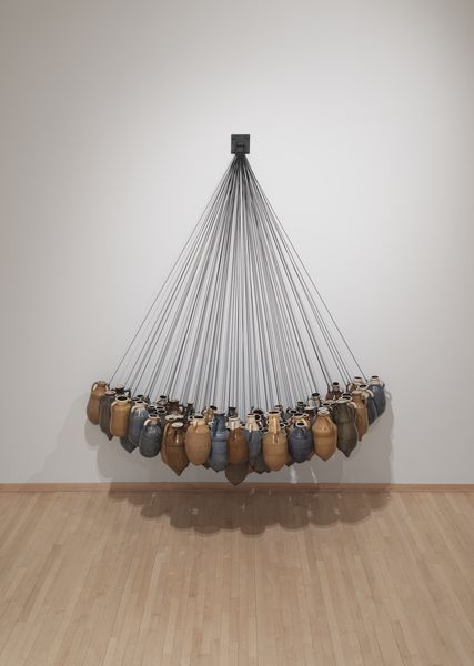 Installation gallery view of hanging ceramics and mixed media artwork by Bradford Davis