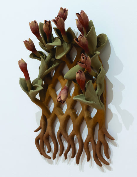 Ceramic tulips sculpture hung on a wall