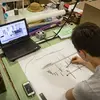architecture student drafting a design with pencil