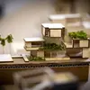 An architectural model of a building with trees