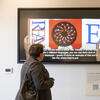 A student reading text on a tv.