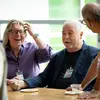 Three faculty members laughing