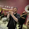 members of SNACKTIME performing at the 2024 Tyler Commencement