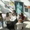 people engaging with the Painter's Guild table at the Tyler Block Party