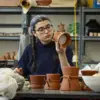 student working in ceramic studio