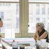 people conversing in the studio space