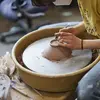 ceramics student at a wheel