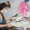 sculpture student working at table on art