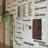wall in sculpture studio space showing the names of guest lecturers