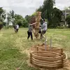 students collaborating on a large outdoor installation project