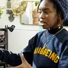 Graduate student speaking to a professor in their studio