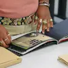 student examining an art book