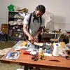 An artist at work in his studio