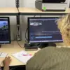 scholars work on a video editing project