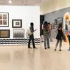 attendees view the gallery during the opening of the Pyramid Club 1937-2035 Show