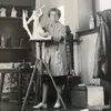 Portrait of Stella Elkins Tyler working on a sculpture in an art studio