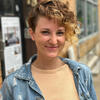 Portrait of a smiling person in a denim jacket