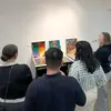 alumni critique work during an event