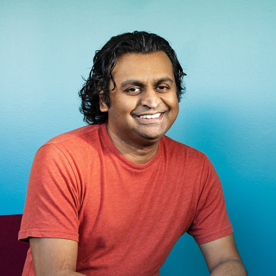 Alpesh Kantilal Patel smiling at the camera.