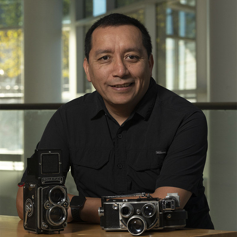 Dilmar sitting in the Tyler lobby with camera equipment